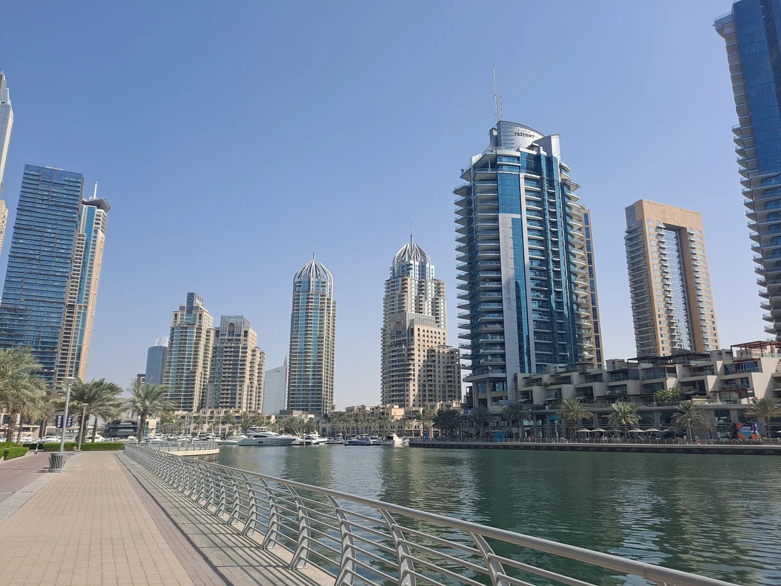Residential towers and boats along the waterfront in Dubai Marina